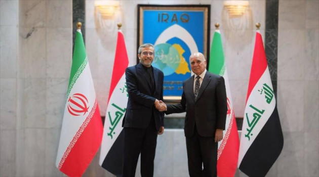 El canciller en funciones de Irán, Ali Baqeri Kani, (izq.) y el ministro de Exteriores de Irak, Foad Husein, Bagdad, 13 de junio de 2024.
